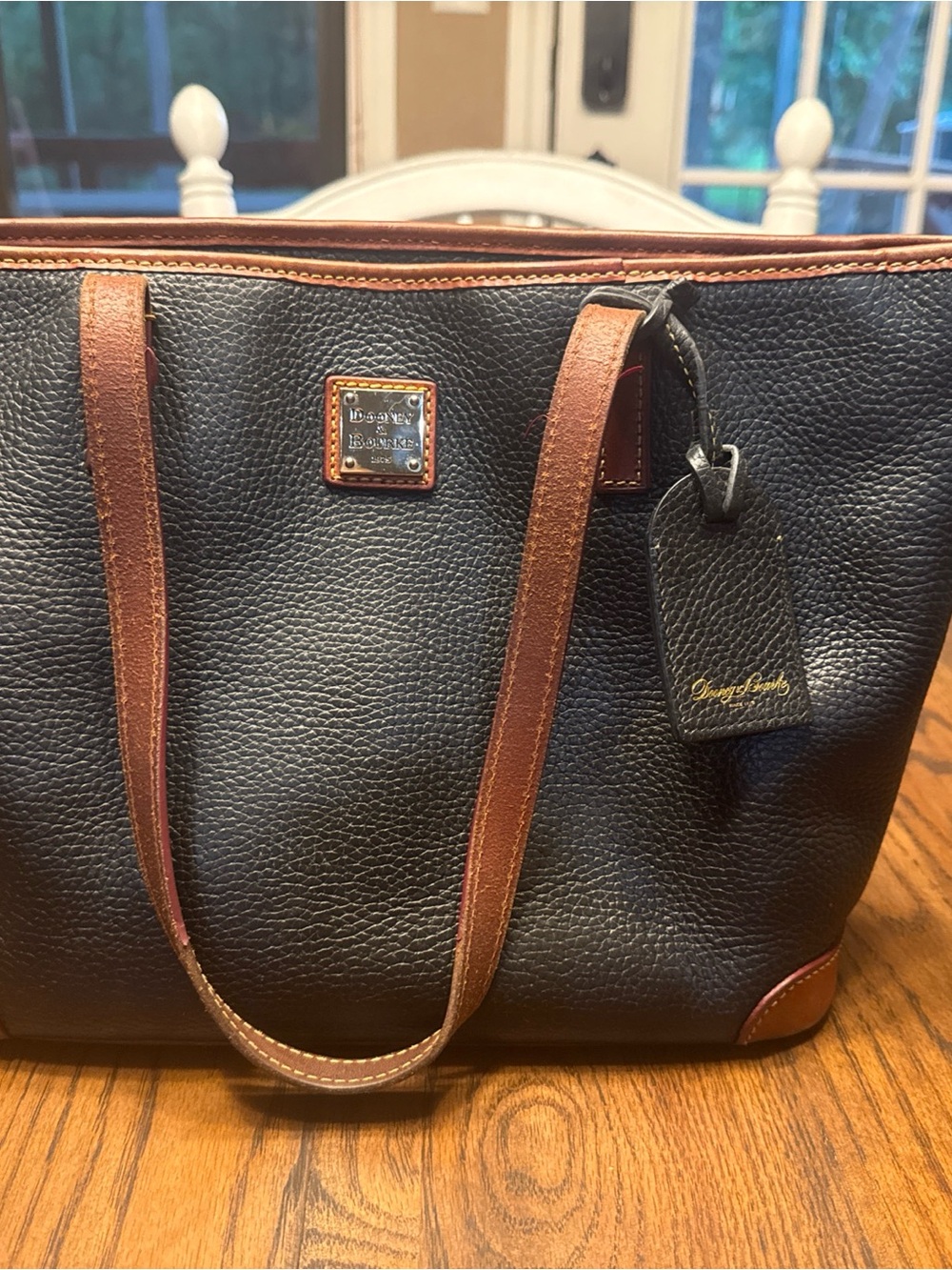 Dooney & Bourke Black Pebble Leather Tote with Brown Trim and Gold Logo